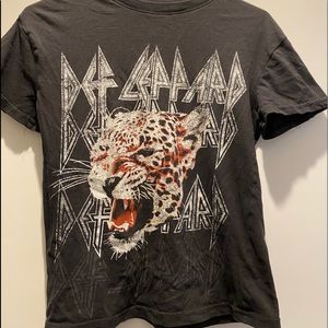 An old thrifted tee-shirt with a leopard head printed on the front